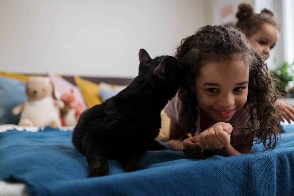 A delightful scene of a child sharing a loving moment with a black cat indoors. - cute girl cat names