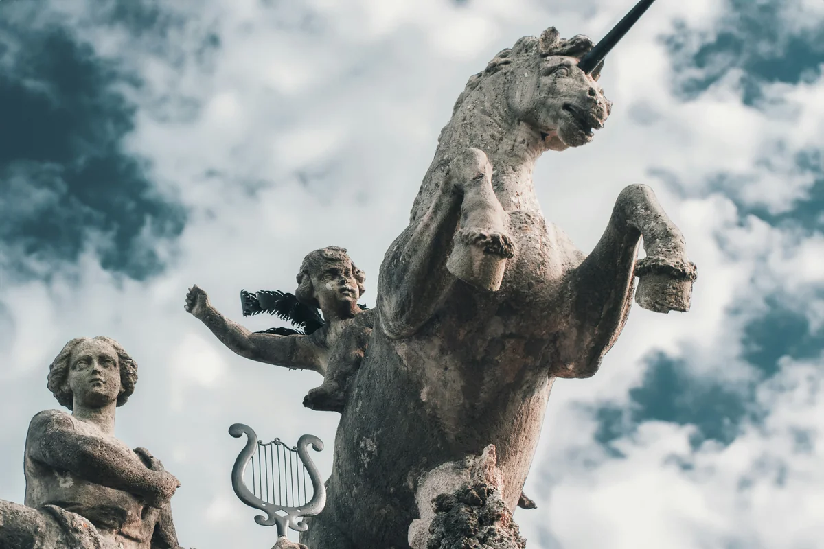 a statue of a horse and a woman holding a tennis racquet - greek mythology pet names