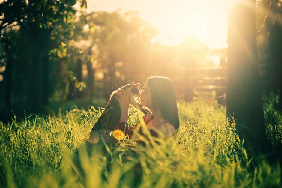 A woman lovingly embraces her pet dog in a sunlit park during sunrise. - nature inspired pet names