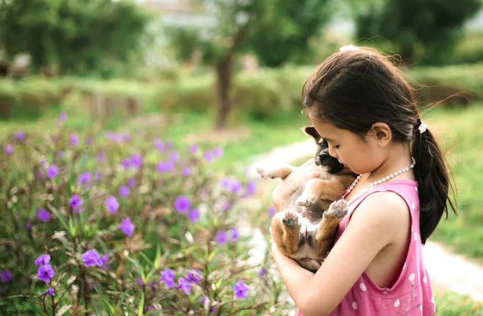 A young girl lovingly holds a puppy in a vibrant, flower-filled garden, creating a heartwarming scene of innocence and nature. - spunky girl puppy names